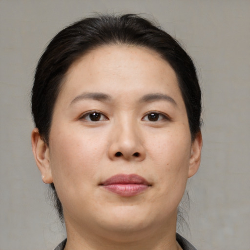 Neutral asian young-adult female with medium  black hair and brown eyes