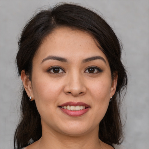 Joyful white young-adult female with medium  brown hair and brown eyes