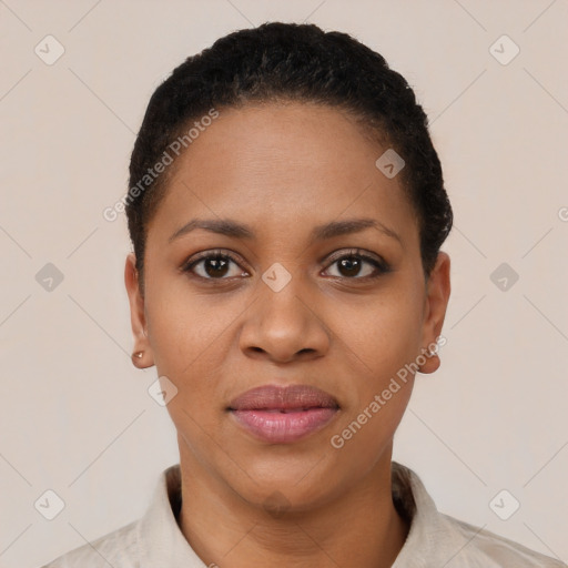 Joyful black young-adult female with short  black hair and brown eyes