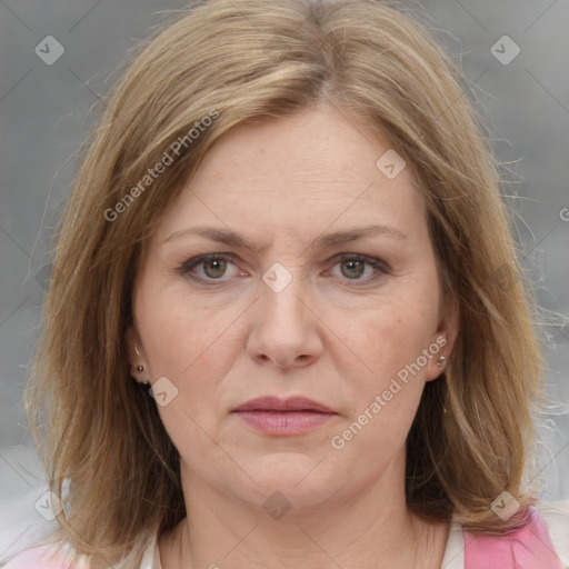 Joyful white adult female with medium  brown hair and grey eyes