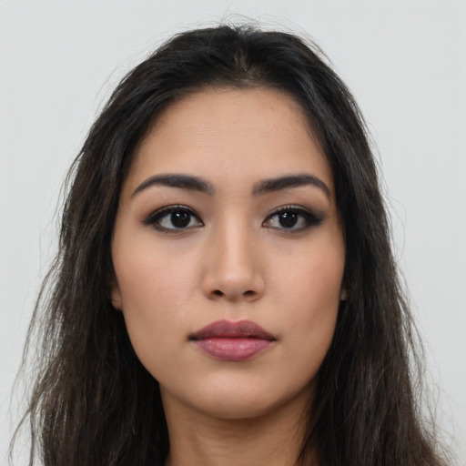 Neutral latino young-adult female with long  brown hair and brown eyes