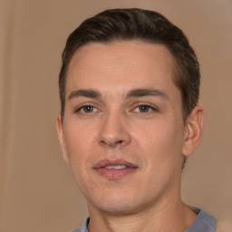 Joyful white young-adult male with short  brown hair and brown eyes