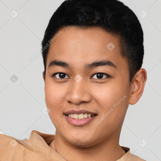 Joyful asian young-adult male with short  black hair and brown eyes