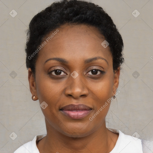 Joyful black young-adult female with short  black hair and brown eyes