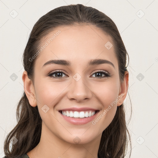 Joyful white young-adult female with long  brown hair and grey eyes