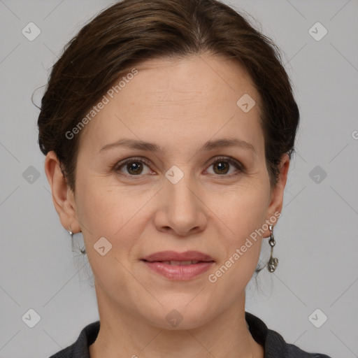 Joyful white adult female with medium  brown hair and grey eyes