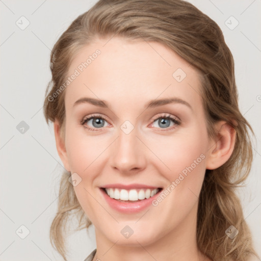 Joyful white young-adult female with medium  brown hair and blue eyes