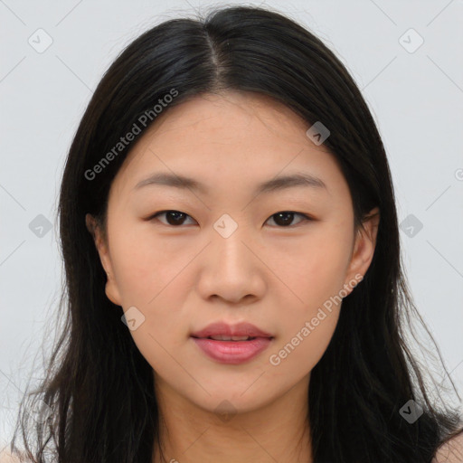 Joyful asian young-adult female with long  brown hair and brown eyes