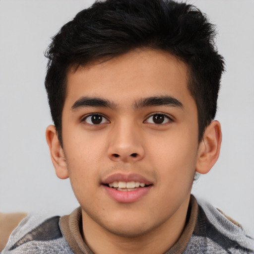 Joyful asian child male with short  brown hair and brown eyes
