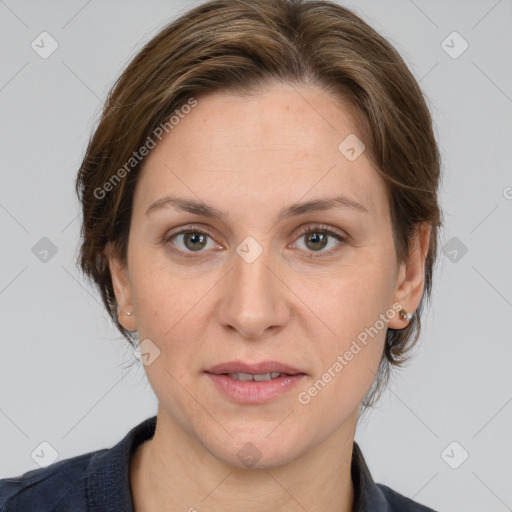 Joyful white adult female with medium  brown hair and grey eyes