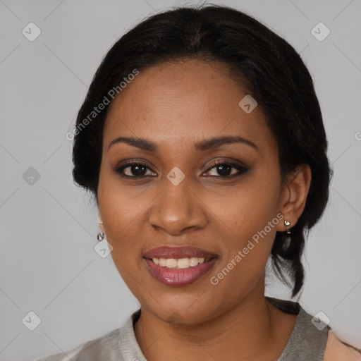 Joyful black young-adult female with medium  black hair and brown eyes