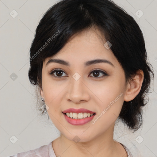 Joyful asian young-adult female with medium  black hair and brown eyes