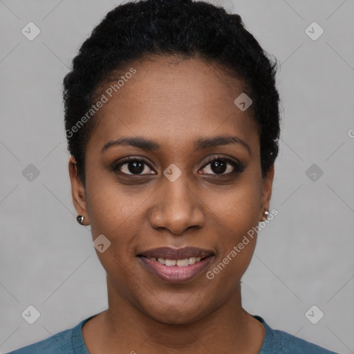 Joyful black young-adult female with short  black hair and brown eyes