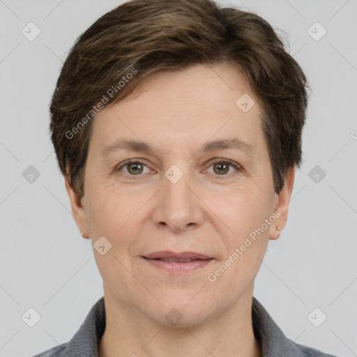 Joyful white adult female with short  brown hair and brown eyes