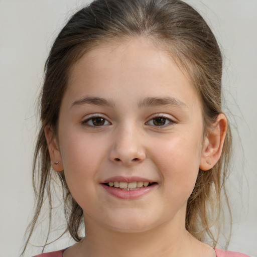 Joyful white child female with medium  brown hair and brown eyes