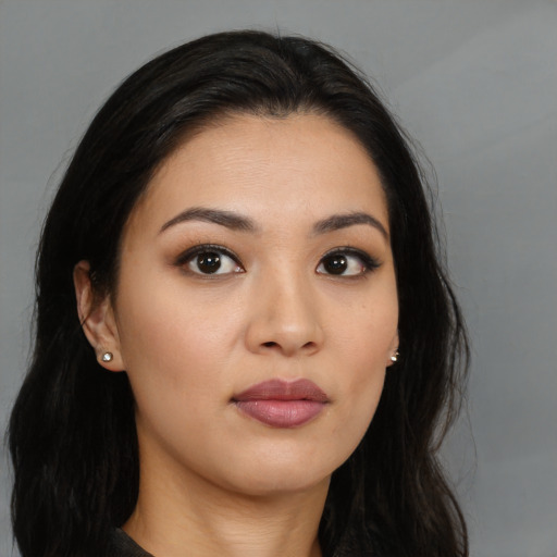 Neutral latino young-adult female with long  black hair and brown eyes