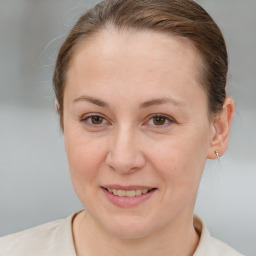 Joyful white adult female with short  brown hair and brown eyes