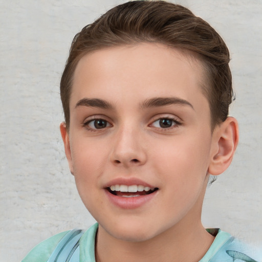 Joyful white child female with short  brown hair and brown eyes