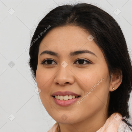 Joyful latino young-adult female with medium  brown hair and brown eyes