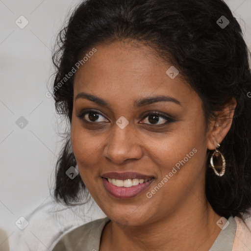 Joyful black young-adult female with long  brown hair and brown eyes