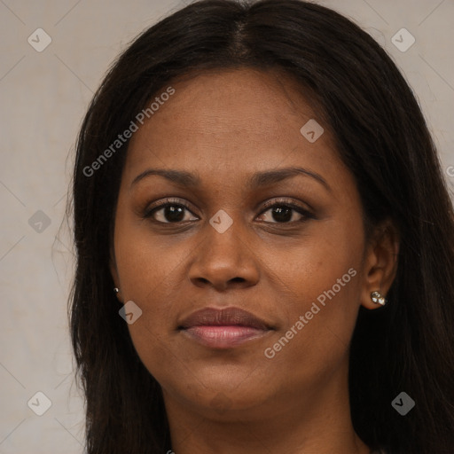 Joyful black young-adult female with long  brown hair and brown eyes