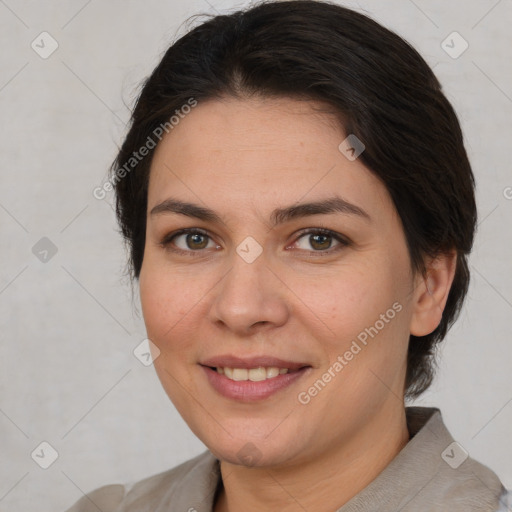 Joyful white adult female with medium  brown hair and brown eyes