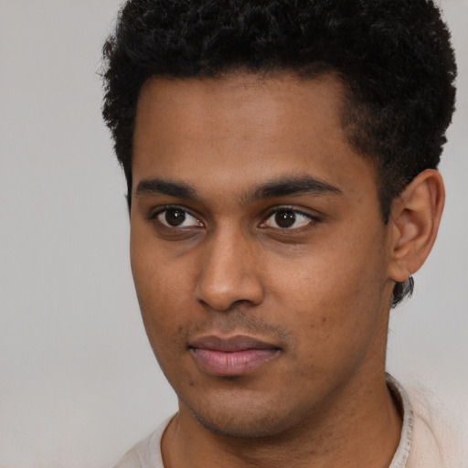 Neutral latino young-adult male with short  brown hair and brown eyes