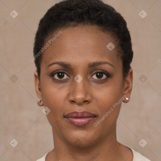 Joyful black young-adult female with short  brown hair and brown eyes