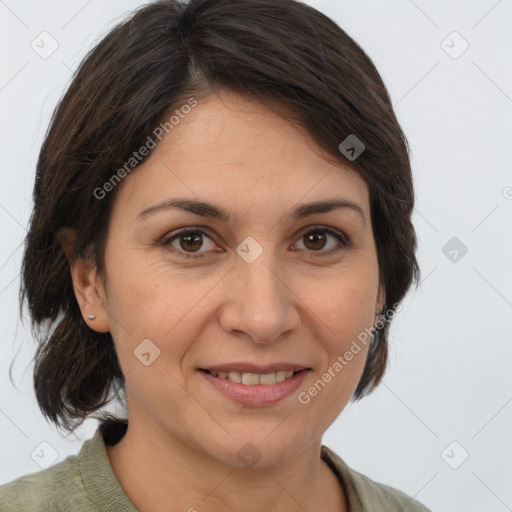 Joyful white adult female with medium  brown hair and brown eyes