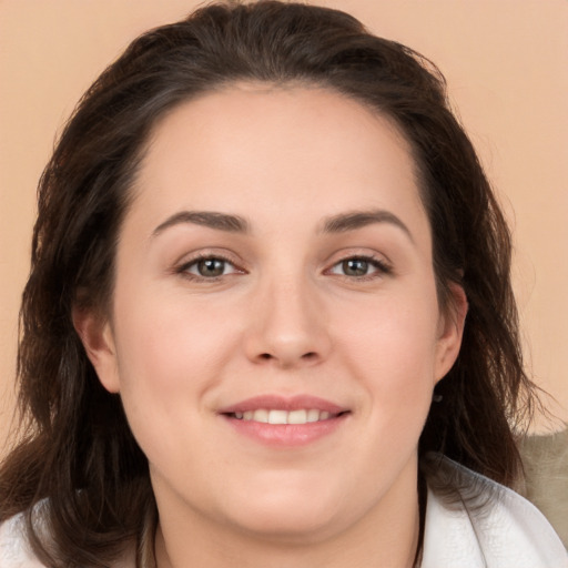 Joyful white young-adult female with medium  brown hair and brown eyes