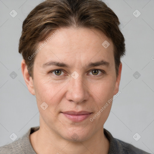 Joyful white adult female with short  brown hair and grey eyes