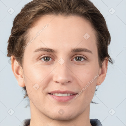 Joyful white young-adult female with short  brown hair and grey eyes