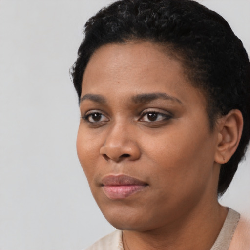 Neutral black young-adult female with short  black hair and brown eyes