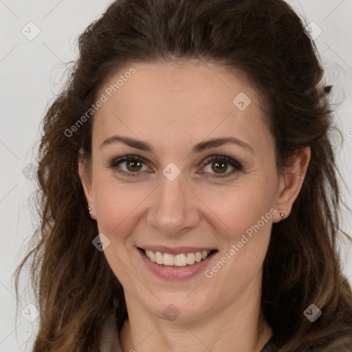 Joyful white adult female with long  brown hair and brown eyes