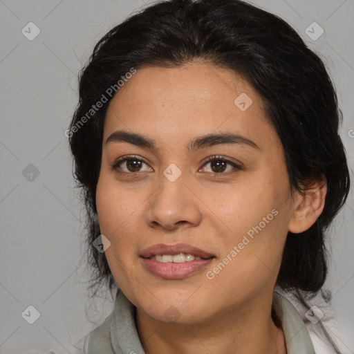 Joyful latino young-adult female with medium  brown hair and brown eyes