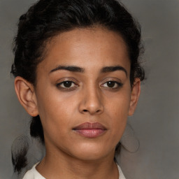 Neutral black young-adult female with short  brown hair and brown eyes