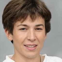 Joyful white adult female with short  brown hair and brown eyes
