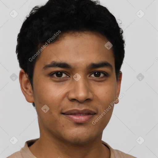 Joyful latino young-adult male with short  brown hair and brown eyes