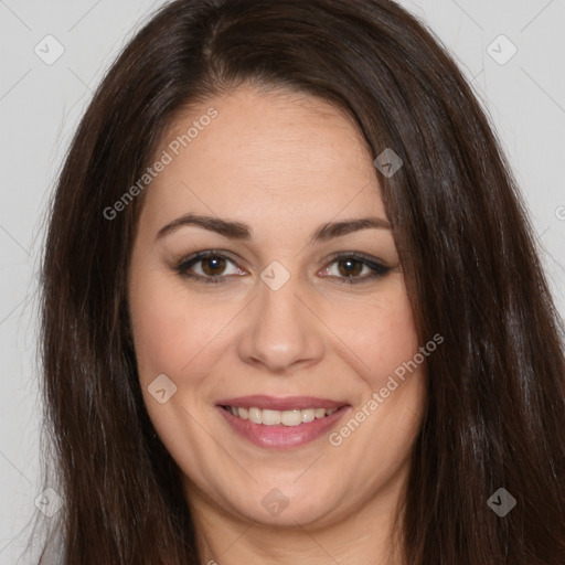 Joyful white adult female with long  brown hair and brown eyes