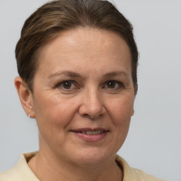 Joyful white adult female with short  brown hair and brown eyes