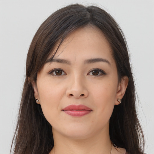 Joyful asian young-adult female with long  brown hair and brown eyes