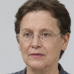 Joyful white middle-aged female with short  brown hair and brown eyes