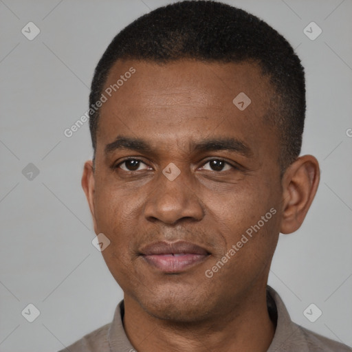 Joyful latino young-adult male with short  brown hair and brown eyes