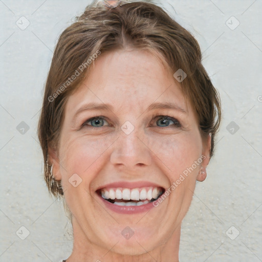 Joyful white adult female with short  brown hair and grey eyes