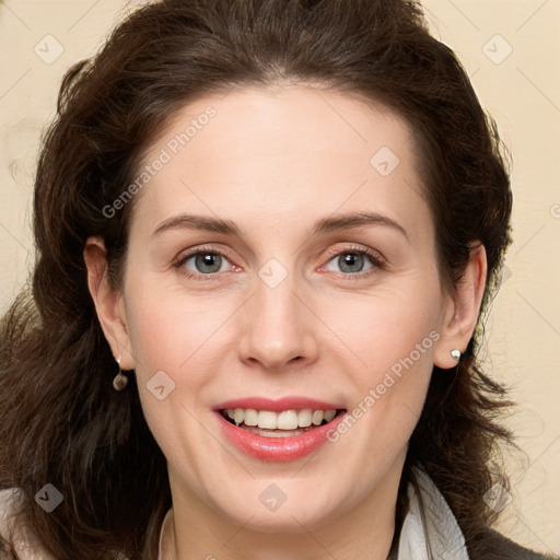 Joyful white young-adult female with long  brown hair and green eyes