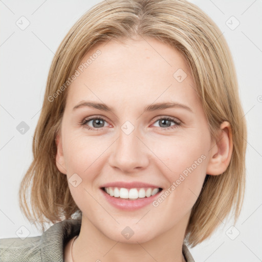 Joyful white young-adult female with medium  brown hair and blue eyes