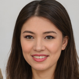 Joyful asian young-adult female with long  brown hair and brown eyes