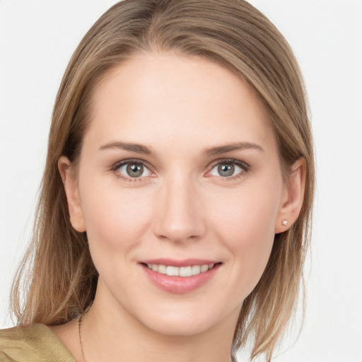 Joyful white young-adult female with medium  brown hair and grey eyes