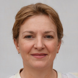 Joyful white adult female with short  brown hair and brown eyes