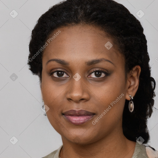 Joyful black young-adult female with long  brown hair and brown eyes